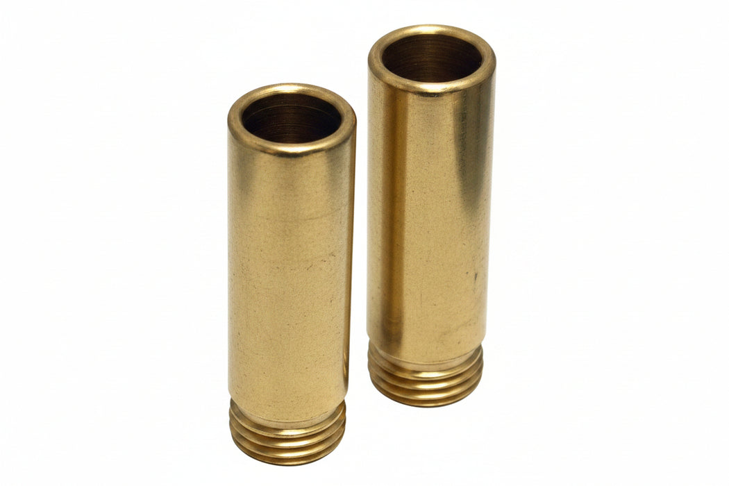 Two brass faucet seats designed for Phoenix faucets, with a cylindrical shape and threaded interior.