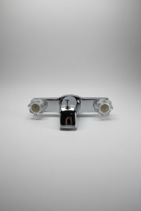Chrome valve handle on a white background